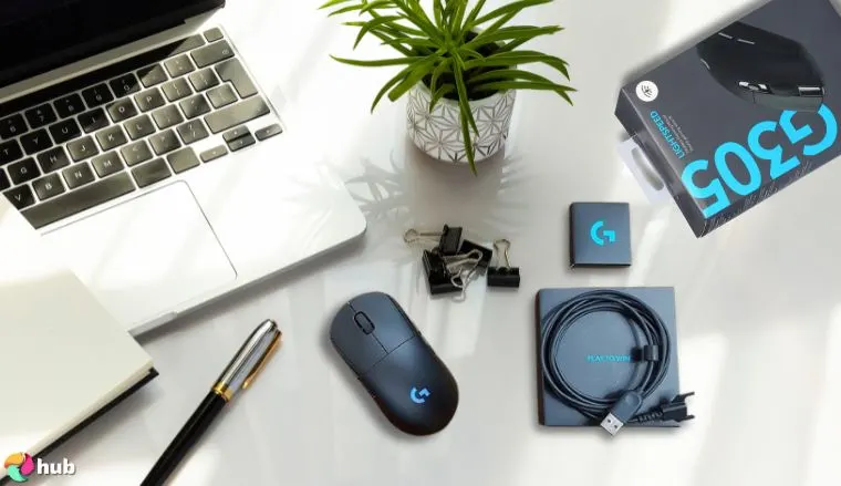Logitech G305 LIGHTSPEED Mouse on a white office desk with creative arrangement for a review