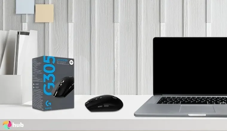 Logitech G305 LIGHTSPEED Wireless Gaming Mouse on a white office desk styled neatly for a review