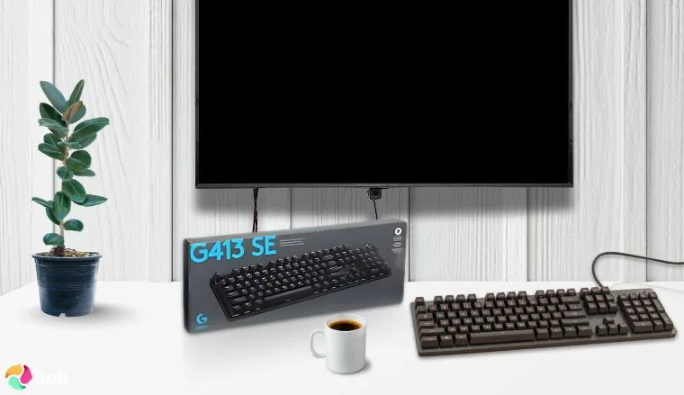Logitech G413 SE Full-Size Mechanical Gaming Keyboard on a white office desk with decorative items for a review