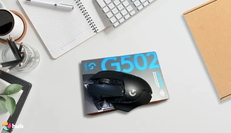 Logitech G502 Lightspeed Wireless Gaming Mouse on a white office desk with professional arrangement for a review