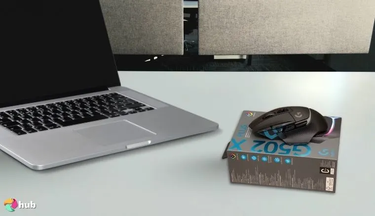 Logitech G502 X Plus Gaming Mouse on a white office desk with simple styling for a review