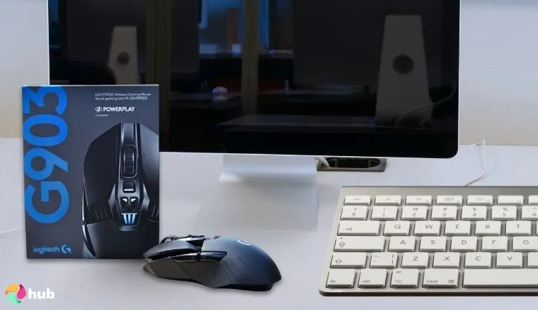Logitech G903 LIGHTSPEED Mouse on a white office desk in close-up for a review