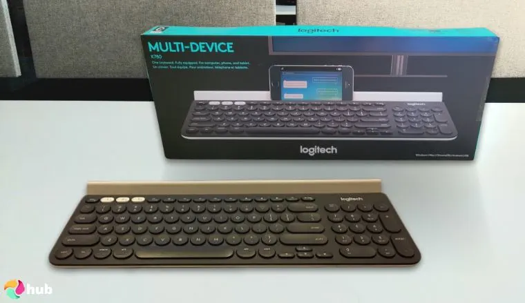 Logitech K780 Multi-Device Wireless Keyboard on a white office desk in a top-down view for a review
