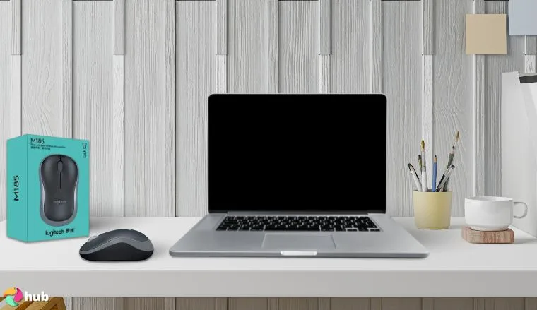 Logitech M185 Mouse on a white office desk styled neatly for a review