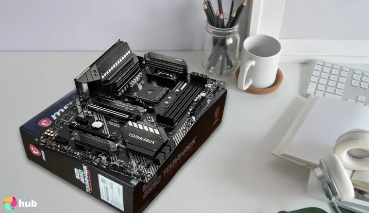 MSI MAG B550 TOMAHAWK AMD Motherboard on a white office desk styled for promotional review
