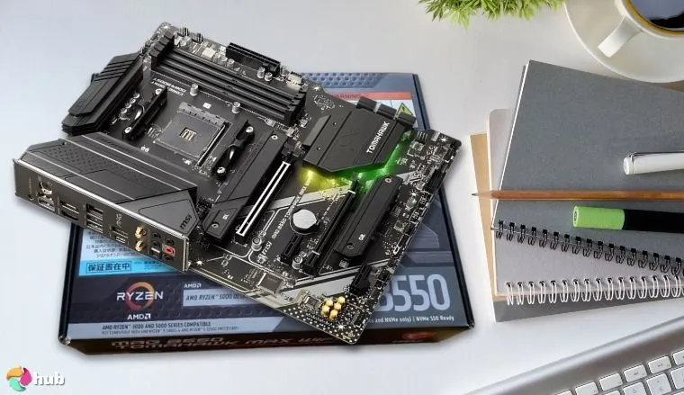 MSI MAG B550 Tomahawk MAX WiFi Motherboard on a white office desk styled for promotional review