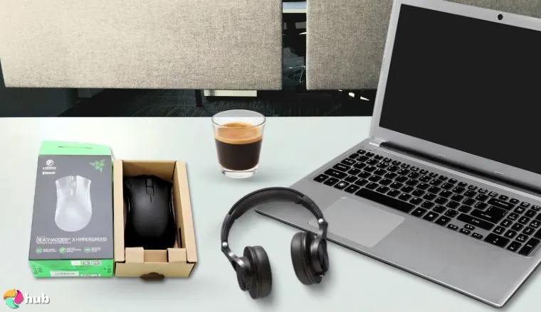 Razer DeathAdder V2 X Gaming Mouse on a white office desk in a clean setup for a review