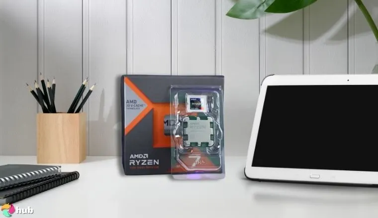 Ryzen 7 7800X3D AMD CPU on a white office desk styled neatly for a review