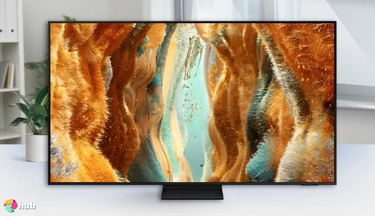 Samsung Neo QLED QN70F 4K Mini LED Smart TV on a white office desk in a well-lit setting for a review