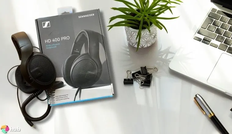 Sennheiser HD 400S Headphones on a white office desk in a well-lit setting for a review