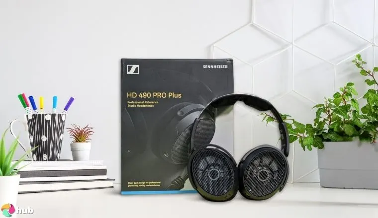 Sennheiser HD 490 PRO Headphones on a white office desk with creative arrangement for a review