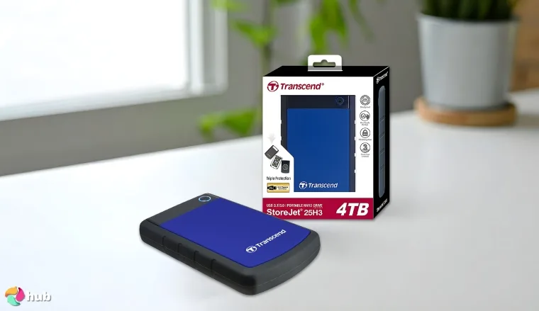 Transcend 4TB USB 3.1 Gen 1 StoreJet HDD on a white office desk in a top-down view for a review