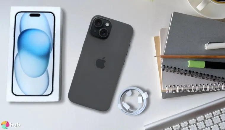 iPhone 15 Apple smartphone on a white office desk with creative arrangement for a review