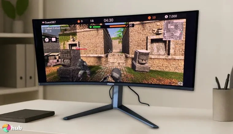 AOC Agon PRO AG346UCD 34” Gaming Monitor on a white office desk in a minimalist setup for a review