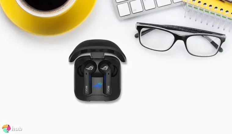 ASUS ROG Cetra True Earbuds on a white office desk styled neatly for a review