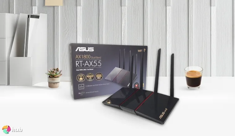 ASUS RT-AX55 Router on a white office desk with soft lighting for a review