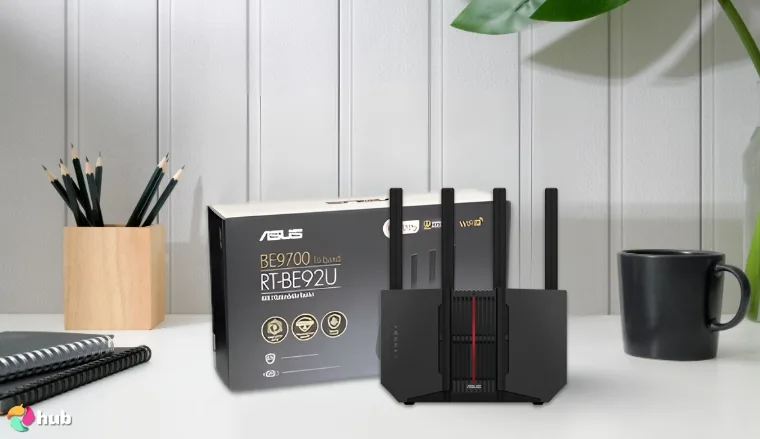 ASUS RT-BE92U BE9700 Router on a white office desk with balanced composition for a review