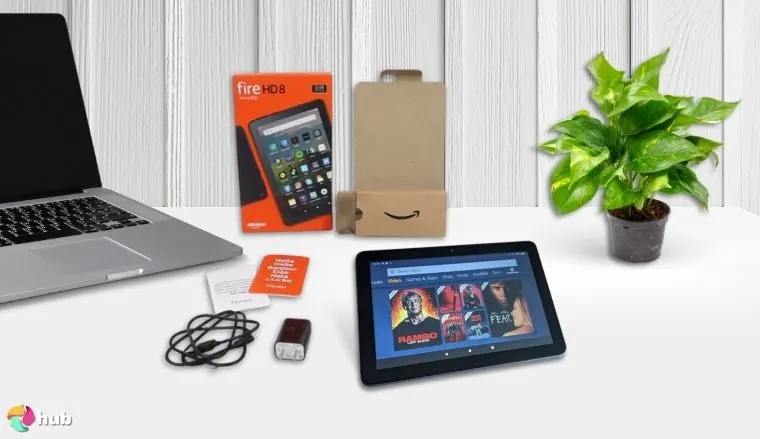 Amazon Fire HD 8 Tablet on a white office desk with decorative items for a review
