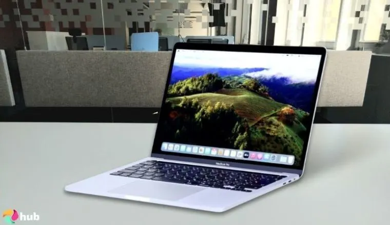Apple MacBook Pro 2024 (M4 Pro) on a white office desk styled for a review