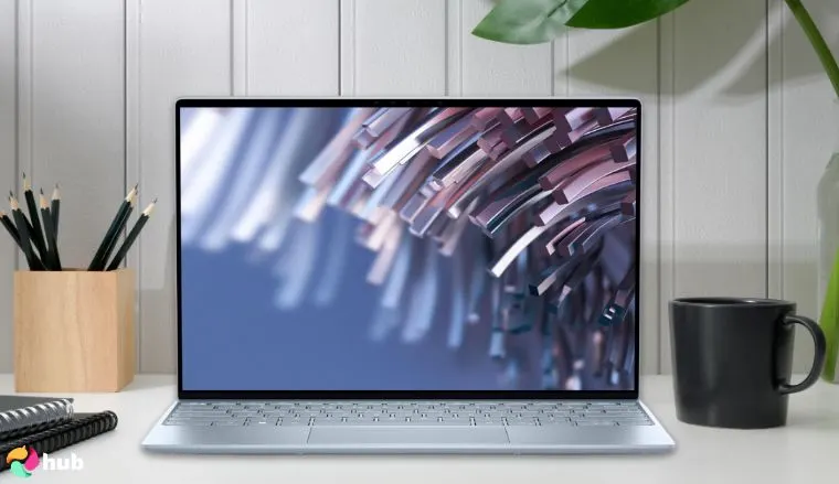 Dell XPS 13 Laptop on a white office desk styled neatly for a review