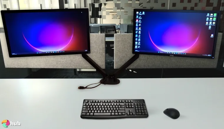 EVEO 14 “-32” Dual Monitor Arm on a white office desk with simple styling for a review