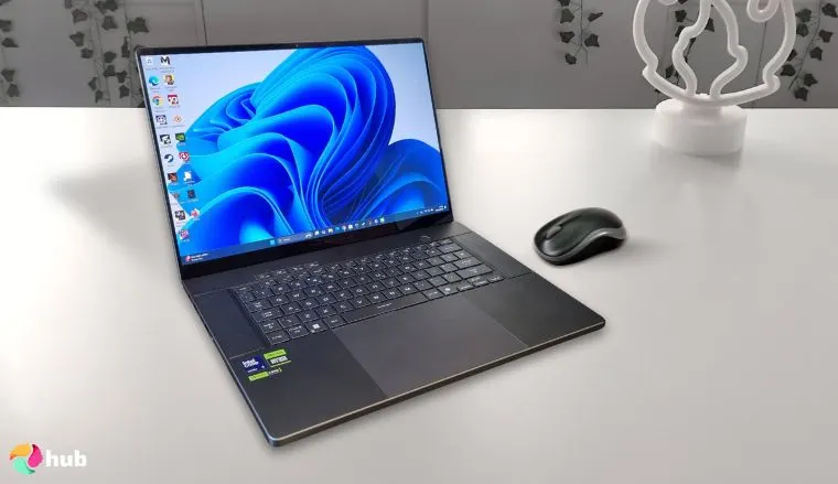 HIDevolution ASUS ROG Zephyrus G16 Laptop on a white office desk in a minimalist setup for a review