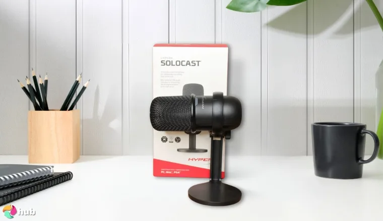 HyperX SoloCast Microphone on a white office desk arranged for a review
