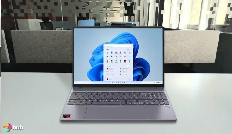 Lenovo IdeaPad Premium Series Laptop on a white office desk with simple styling for a review