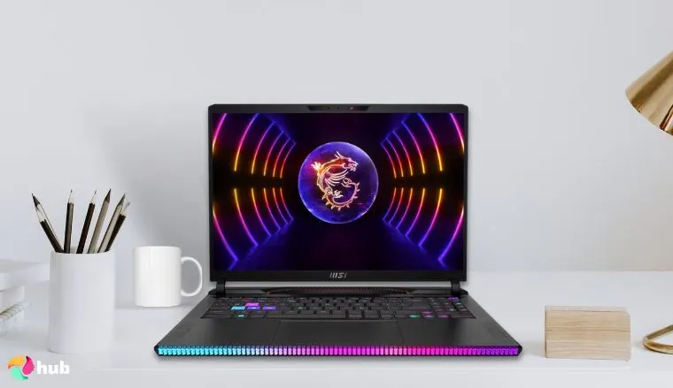 MSI Raider GE68HX Laptop on a white office desk with creative arrangement for a review