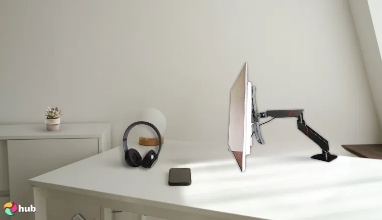 Secretlab Magnus Monitor Arm on a white office desk set up for testing and review