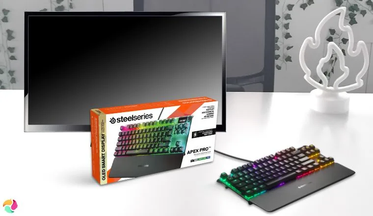 SteelSeries Apex Pro Gaming Keyboard on a white office desk styled neatly for a review