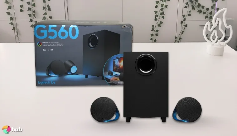 Logitech G560 RGB Speakers on a white office desk in a top-down view for a review
