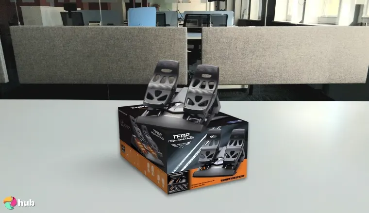 Thrustmaster TFRP Flight Rudder Pedals on a white office desk in a minimalist setup for a review