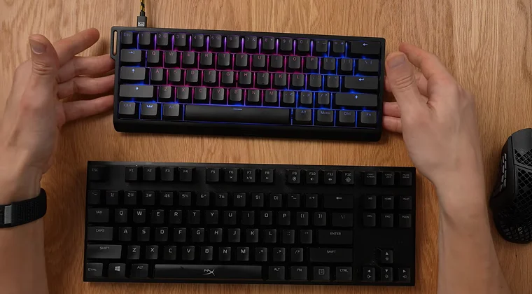 Two keyboards on a table, one smaller 60% keyboard