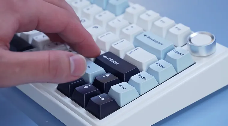 Fingers pressing keys on a keyboard