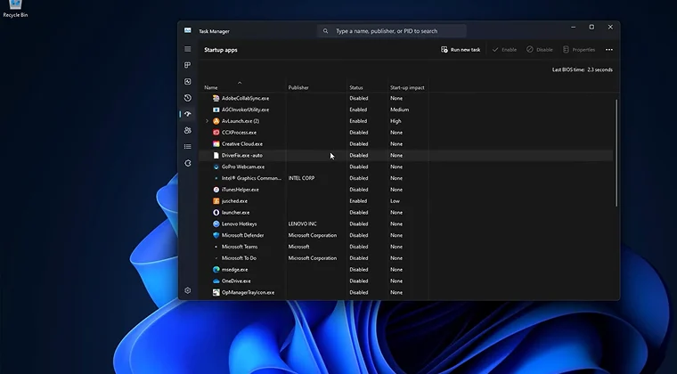 Task Manager window open to the Startup tab showing enabled and disabled startup programs