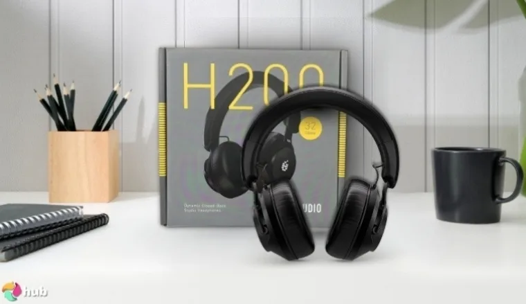 ADAM Audio H200 Studio Headphones on a white office desk with balanced composition for a review