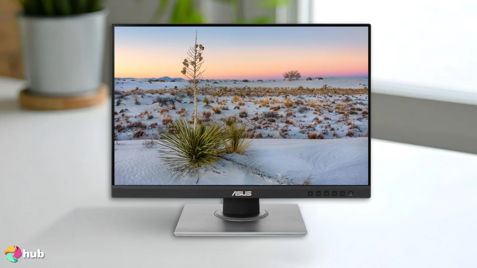 ASUS ProArt Display PA278QV Vertical on a white office desk in a top-down view for a review