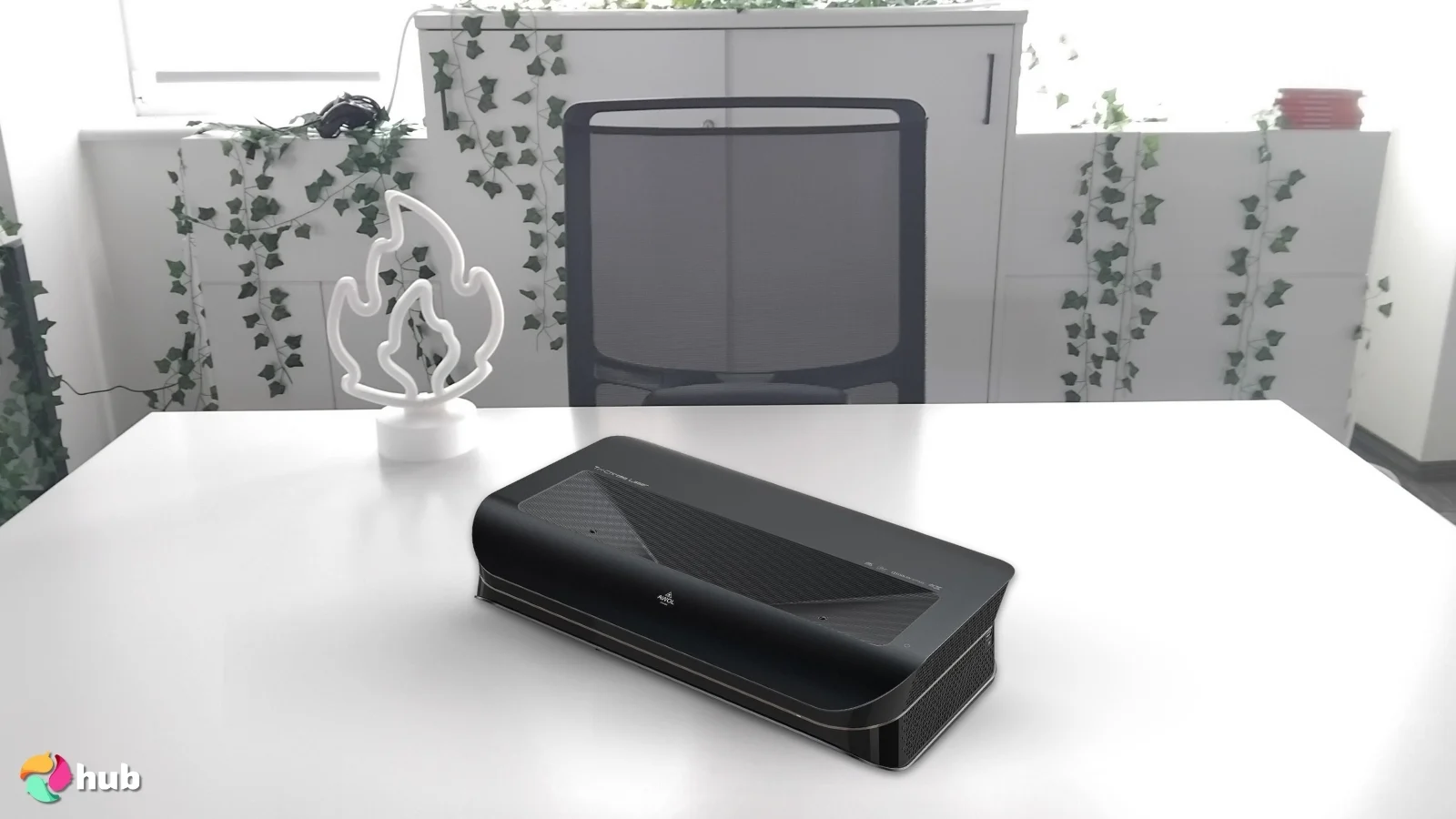 AWOL VISION LTV-3000 Pro 4K Projector on a white office desk in a top-down view for a review