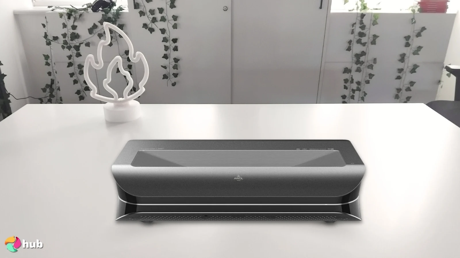 AWOL Vision LTV-2500 Projector on a white office desk in a minimalist setup for a review