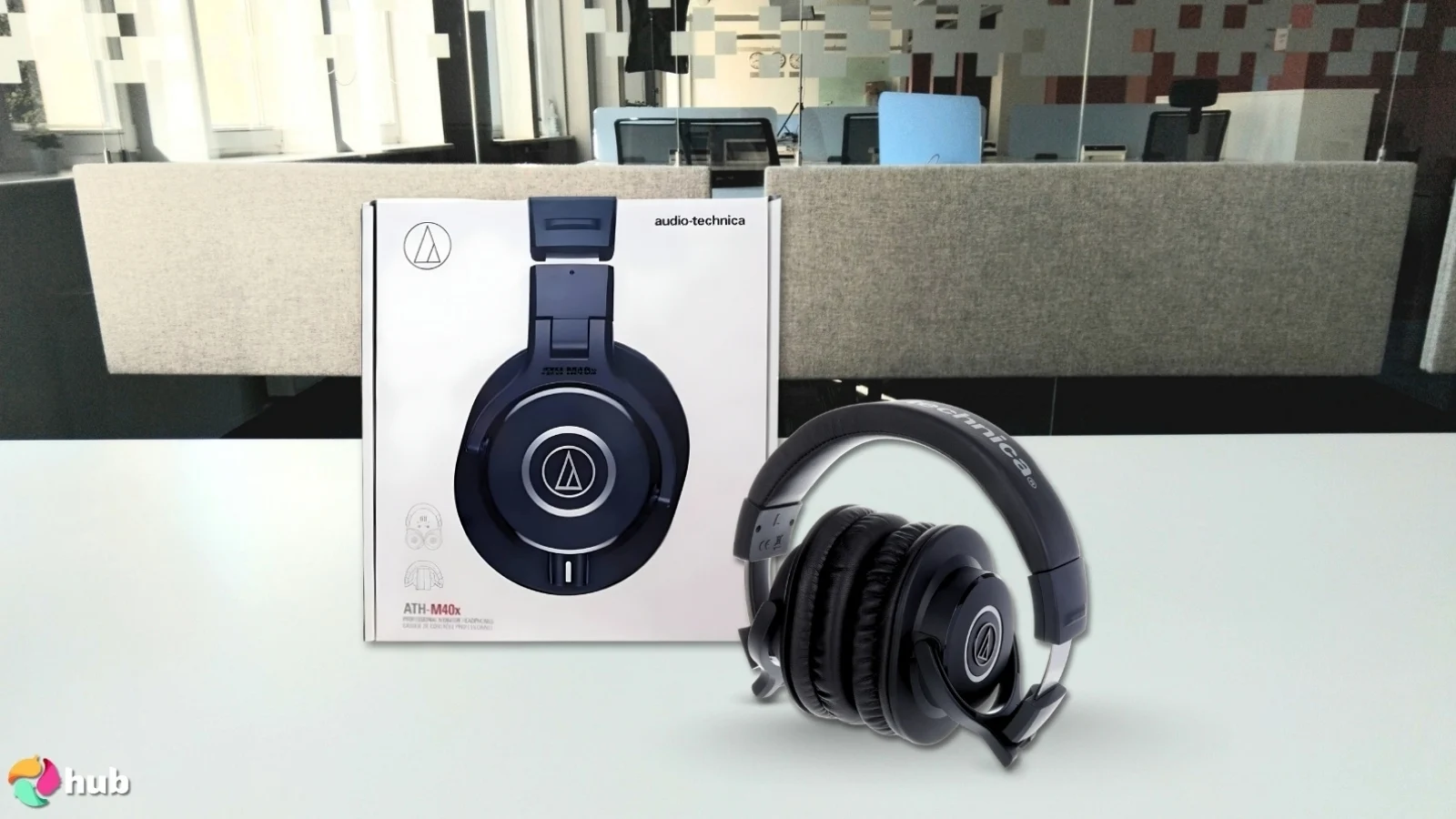 Audio-Technica ATH-M40x Headphones on a white office desk with soft lighting for a review