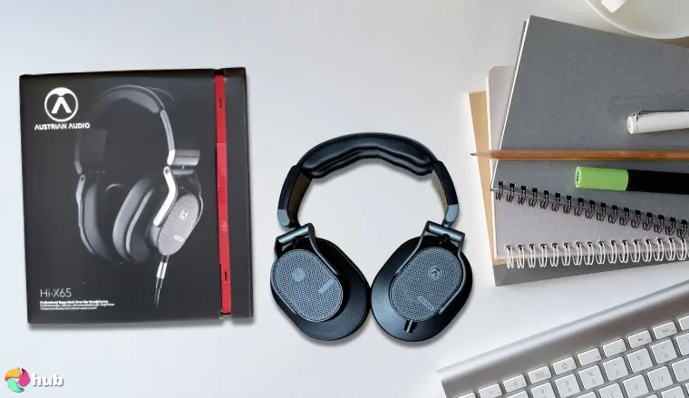 Austrian Audio Hi-X65 Studio Headphones on a white office desk in a top-down view for a review