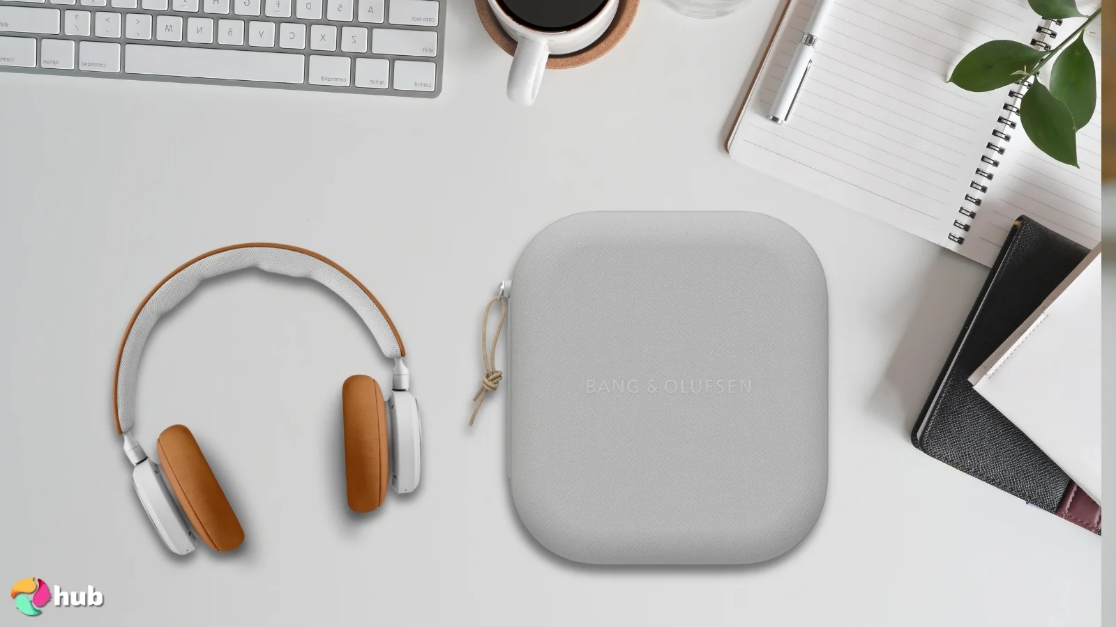 Bang & Olufsen Beoplay HX Headphones on a white office desk in a bright workspace for a review