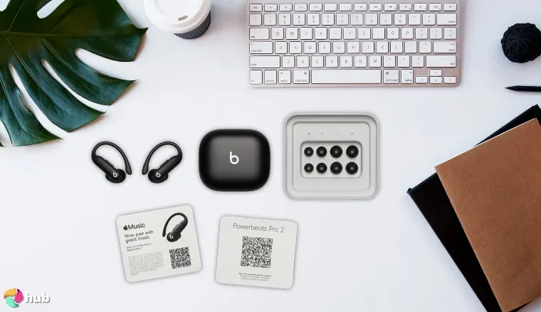 Beats Powerbeats Pro 2 Running Headphones on a white office desk with creative arrangement for a review