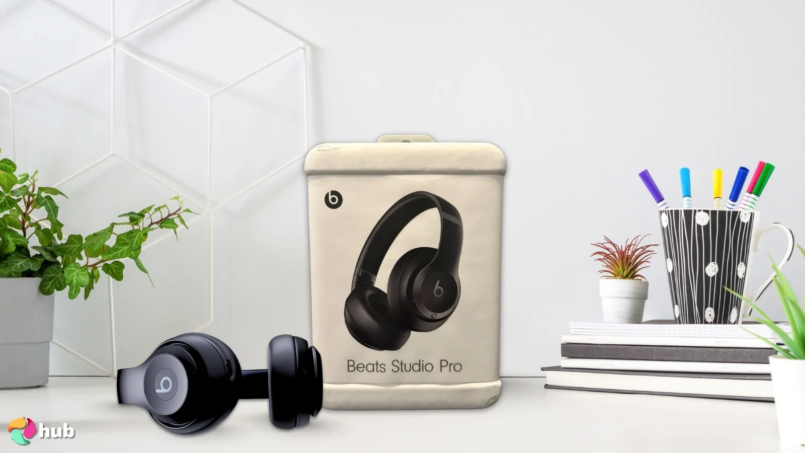 Beats Studio Pro Headphones on a white office desk with neat arrangement for a review