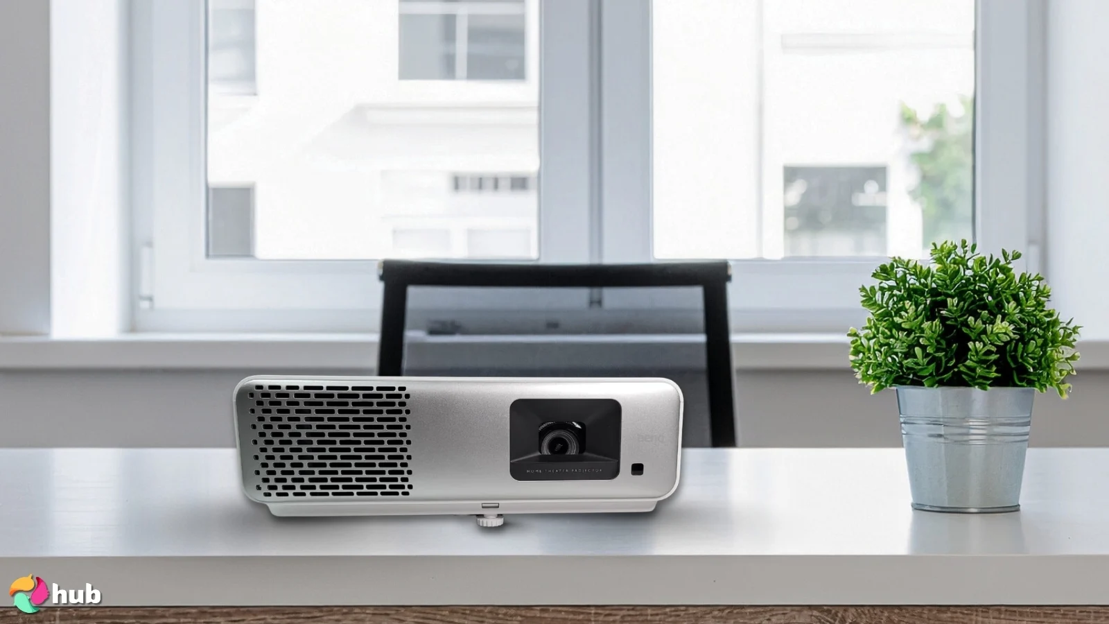 BenQ HT2060 Projector on a white office desk with soft lighting for a review