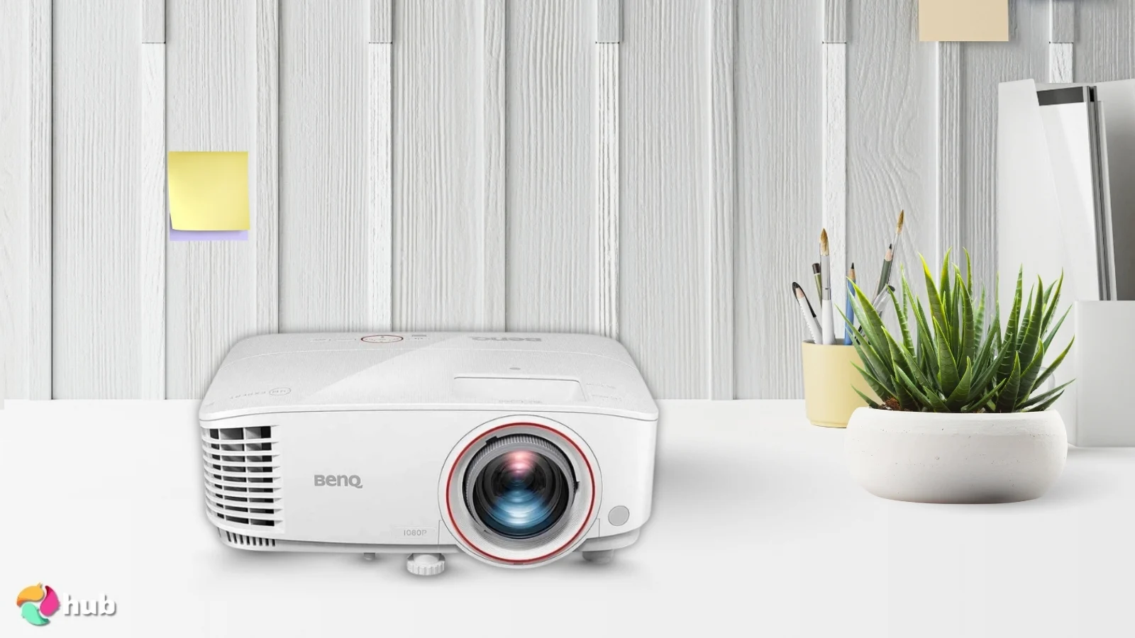 BenQ TH671ST Projector on a white office desk with an editorial style for a review
