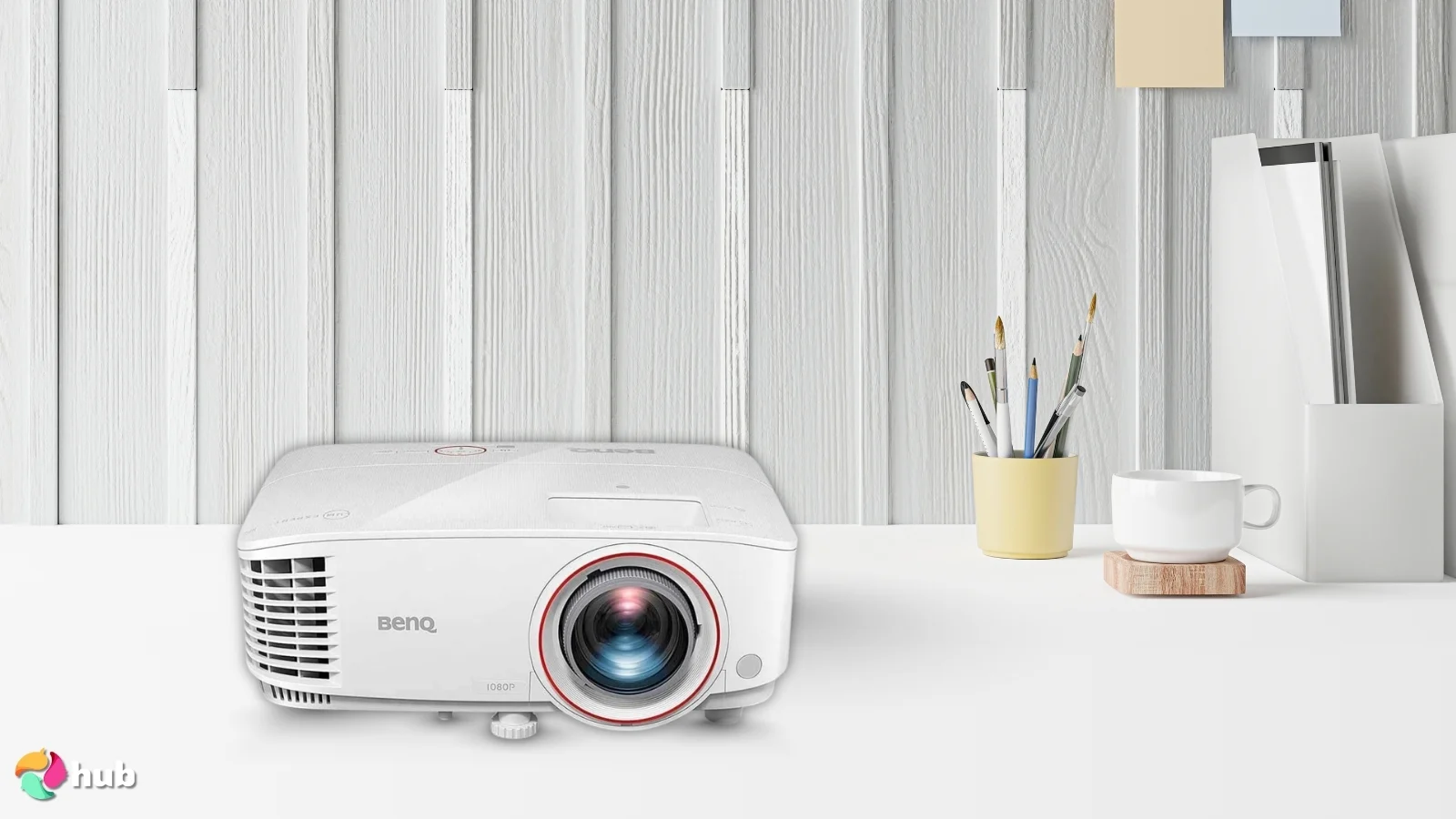 BenQ TH671ST Projector on a white office desk in a bright workspace for a review