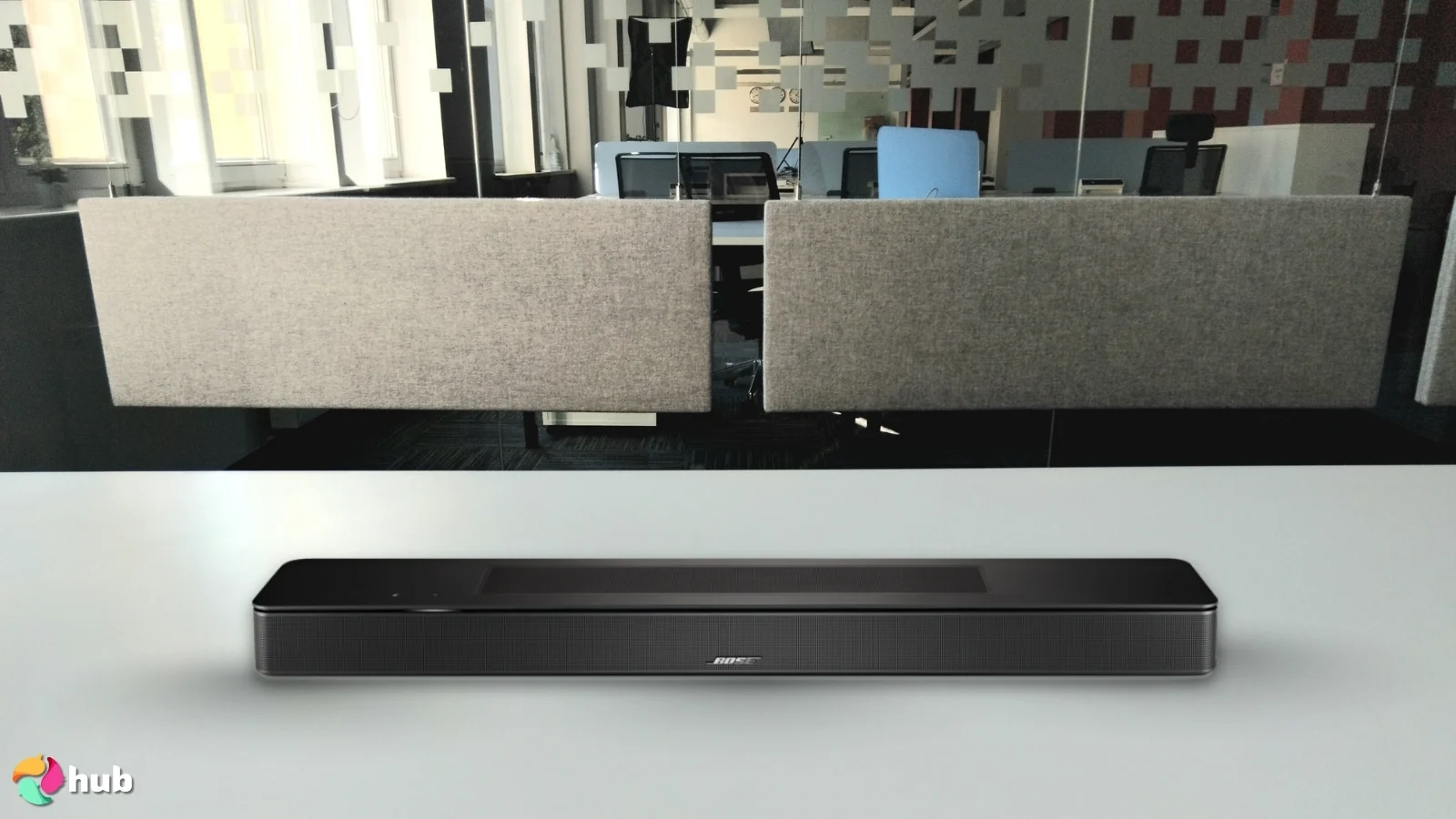Bose Smart Soundbar on a white office desk set up for testing and review