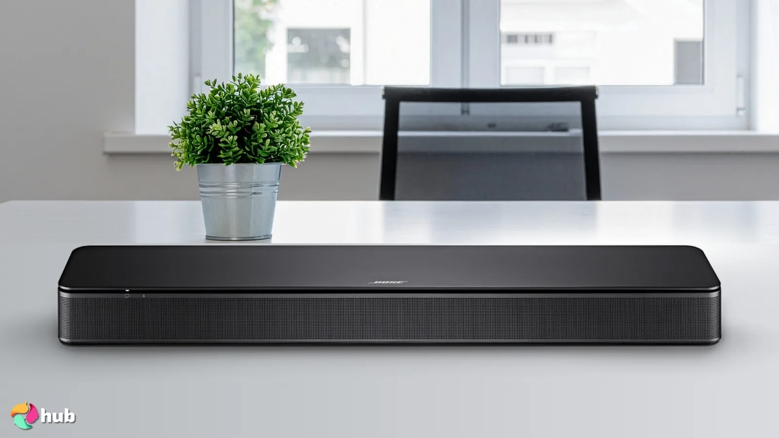 Bose TV Speaker Soundbar on a white office desk with simple styling for a review